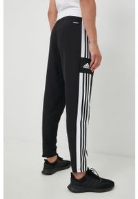 adidas Performance spodnie męskie kolor czarny gładkie. Kolor: czarny. Materiał: tkanina, poliester, skóra, materiał. Wzór: gładki. Sport: fitness #2