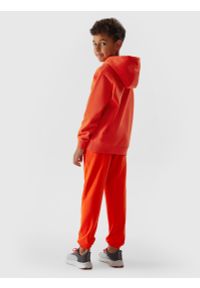 4f - Spodnie dresowe joggery chłopięce. Kolor: pomarańczowy. Materiał: dresówka. Wzór: napisy