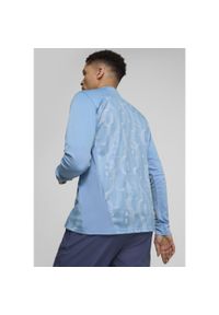 Puma - Męska bluza przedmeczowa z zamkiem 1/4 Manchester City PUMA. Kolor: biały, wielokolorowy, niebieski