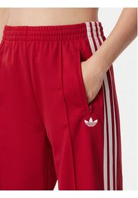 Adidas - adidas Spodnie dresowe Firebird Loose Tracksuit KS4670 Czerwony Loose Fit. Kolor: czerwony. Materiał: syntetyk #2