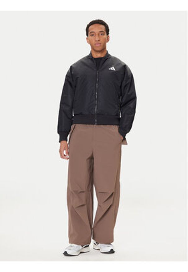 Adidas - adidas Kurtka bomber Stadium JN1825 Czarny Loose Fit. Kolor: czarny. Materiał: syntetyk