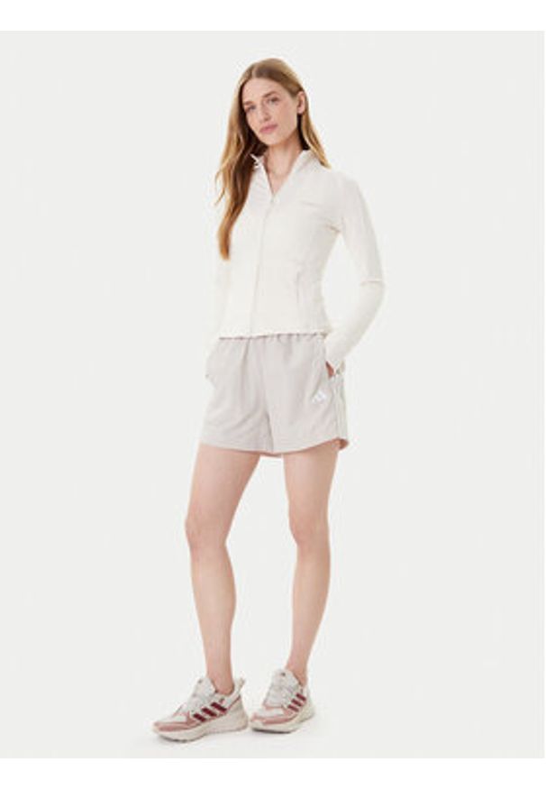 Adidas - adidas Szorty sportowe Essentials 3-Stripes JC8165 Beżowy Loose Fit. Kolor: beżowy. Materiał: syntetyk