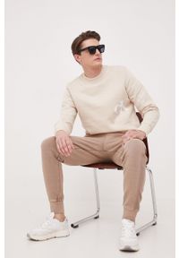 Calvin Klein Jeans spodnie dresowe bawełniane kolor brązowy gładkie. Kolor: brązowy. Materiał: bawełna, dresówka. Wzór: gładki #4