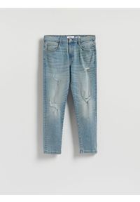 Reserved - Jeansy carrot slim z przetarciami - niebieski. Kolor: niebieski