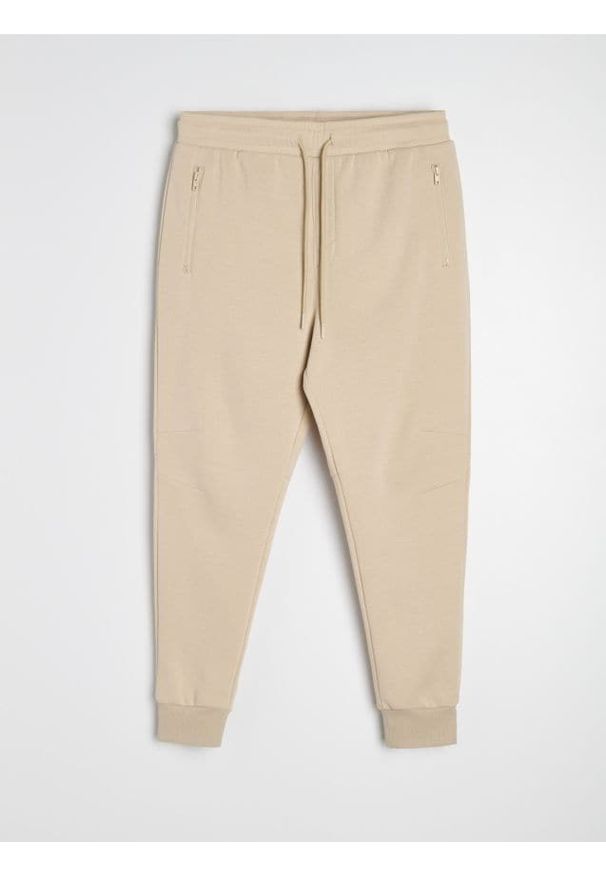 Sinsay - Spodnie dresowe jogger - beżowy. Kolor: beżowy. Materiał: dresówka