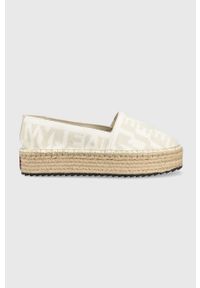 Tommy Jeans espadryle LOGOMANIA ESPADRILLE kolor beżowy na platformie EN0EN02079. Nosek buta: okrągły. Kolor: beżowy. Materiał: poliester, materiał, guma. Wzór: gładki. Obcas: na platformie