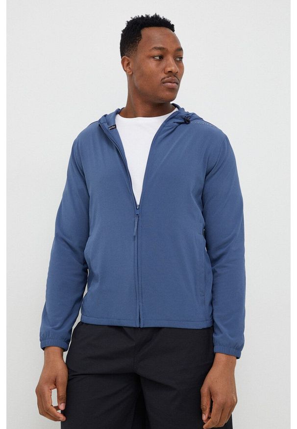 Calvin Klein Performance wiatrówka Essentials kolor granatowy przejściowa. Kolor: niebieski. Materiał: skóra, materiał