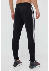 Adidas - adidas spodnie dresowe kolor czarny z nadrukiem. Kolor: czarny. Materiał: dresówka. Wzór: nadruk #3