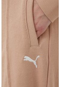 Puma spodnie dresowe kolor beżowy gładkie. Stan: podwyższony. Kolor: beżowy. Materiał: dresówka. Wzór: gładki #3