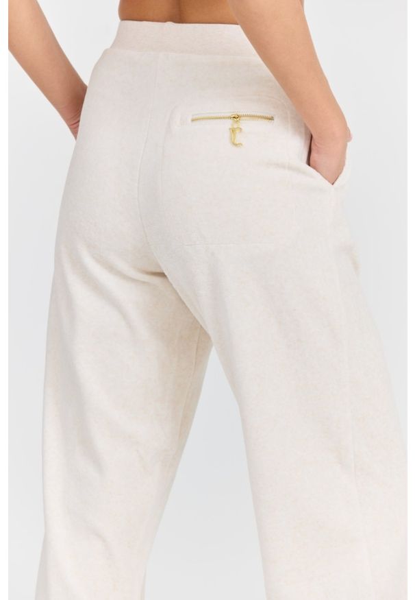 Juicy Couture - JUICY COUTURE Damskie beżowe spodnie dresowe Davidson Gold. Kolor: beżowy. Materiał: dresówka. Długość: długie