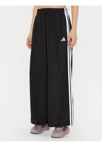 Adidas - adidas Spodnie dresowe Essentials 3-Stripes JE1306 Czarny Loose Fit. Kolor: czarny. Materiał: syntetyk #1