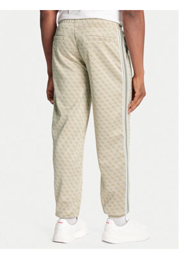 Guess Spodnie dresowe Z5BB19 K2042 Beżowy Regular Fit. Kolor: beżowy. Materiał: syntetyk