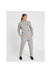 Spodnie damskie do joggingu Hummel OFF-Grid. Kolor: szary. Materiał: bawełna, dresówka, materiał. Wzór: nadruk. Sport: bieganie