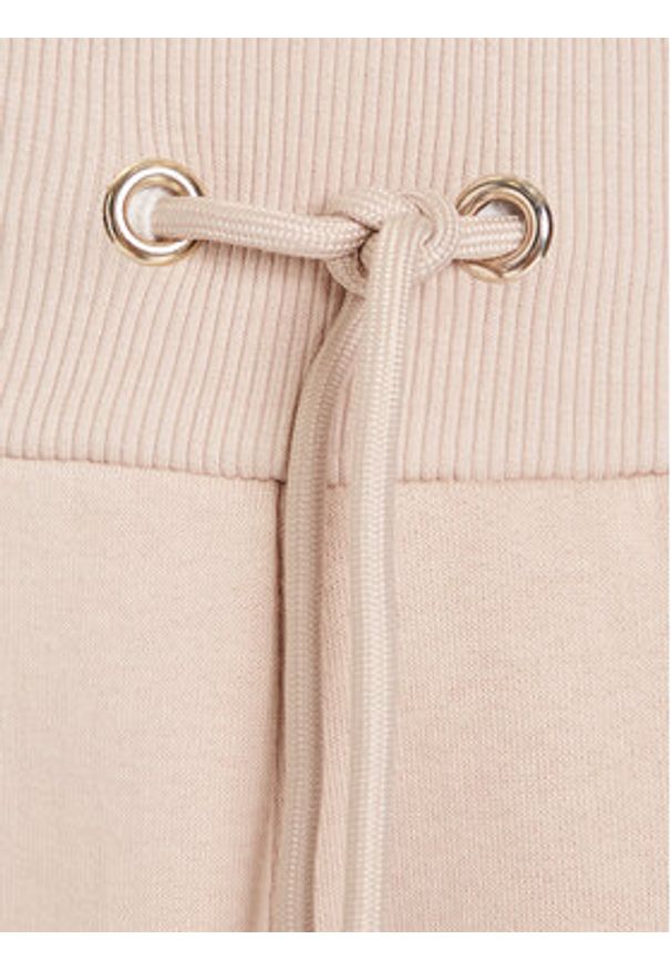 Guess Spodnie dresowe V5BB10 KB681 Beżowy Regular Fit. Kolor: beżowy. Materiał: bawełna