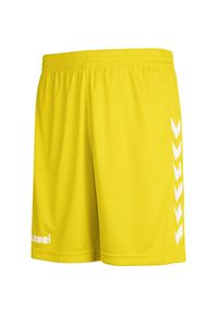 Spodenki sportowe dziecięce Hummel Core Kids Poly Shorts. Okazja: na uczelnię. Kolor: żółty. Styl: sportowy. Sport: joga i pilates