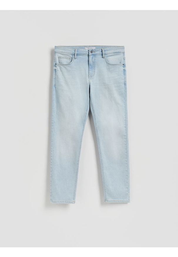Reserved - Jeansy slim z efektem sprania - niebieski. Kolor: niebieski