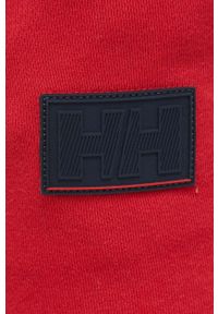 Helly Hansen spodnie dresowe kolor czerwony gładkie. Kolor: czerwony. Materiał: dresówka. Wzór: gładki #4