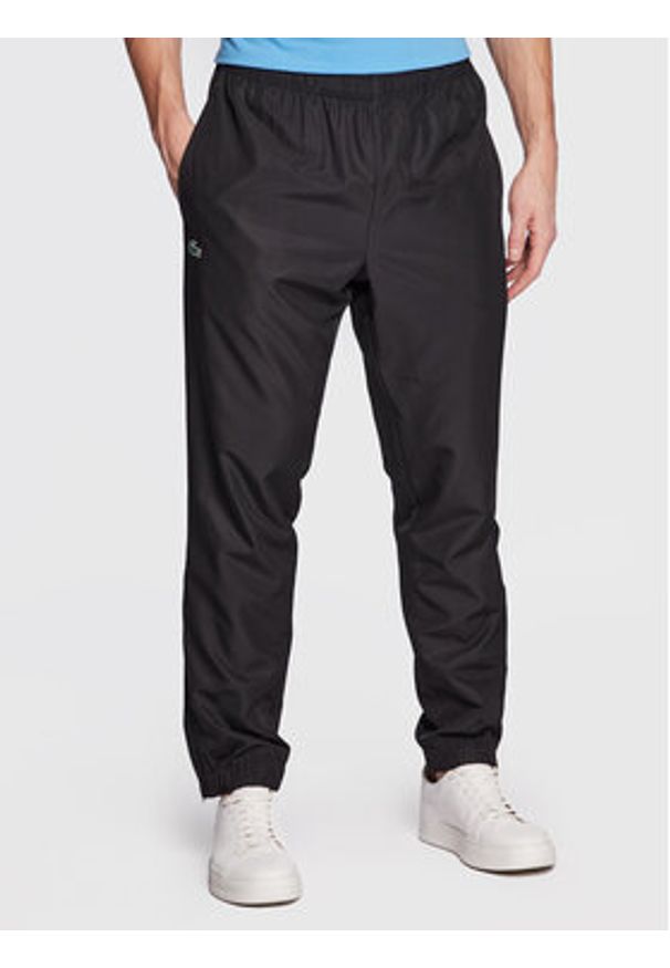 Lacoste Komplet kurtka i spodnie WH2661 Czarny Regular Fit. Kolor: czarny. Materiał: syntetyk