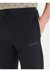 Guess Spodnie dresowe Z6GB02 K2844 Czarny Regular Fit. Kolor: czarny. Materiał: syntetyk #4