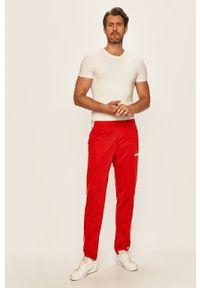 Adidas - adidas - Spodnie. Kolor: czerwony. Materiał: tkanina, poliester. Wzór: aplikacja #4