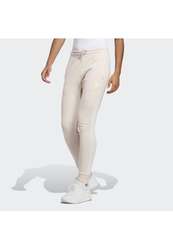 Adidas - Spodnie damskie adidas Essentials 3-Stripes French Terry Cuffed. Kolor: biały. Materiał: materiał. Sport: fitness
