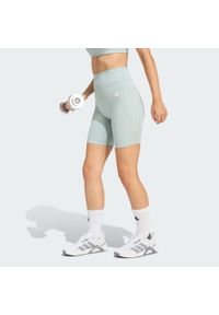 Adidas - Krótkie legginsy Optimé Essentials Stash Pocket 7-Inch. Stan: podwyższony. Kolor: zielony. Długość: krótkie. Sport: fitness #1