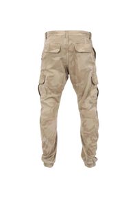 Urban Classics - Męskie Spodnie Joggingowe Camo Cargo. Kolor: brązowy, zielony, wielokolorowy