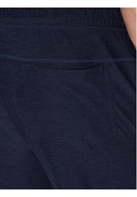 skechers - Skechers Spodnie dresowe Ultra Go Lite MPT108 Granatowy Tapered Fit. Kolor: niebieski. Materiał: syntetyk #5