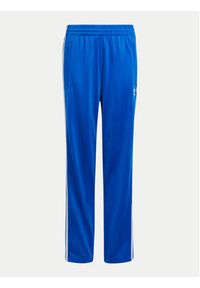 Adidas - adidas Spodnie dresowe Firebird IY9803 Niebieski Regular Fit. Kolor: niebieski. Materiał: syntetyk
