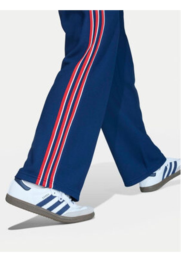 Adidas - adidas Spodnie dresowe Firebird Double Knit KD7825 Granatowy Loose Fit. Kolor: niebieski. Materiał: syntetyk