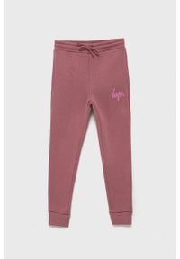 Hype Spodnie dziecięce kolor różowy z nadrukiem. Kolor: różowy. Wzór: nadruk