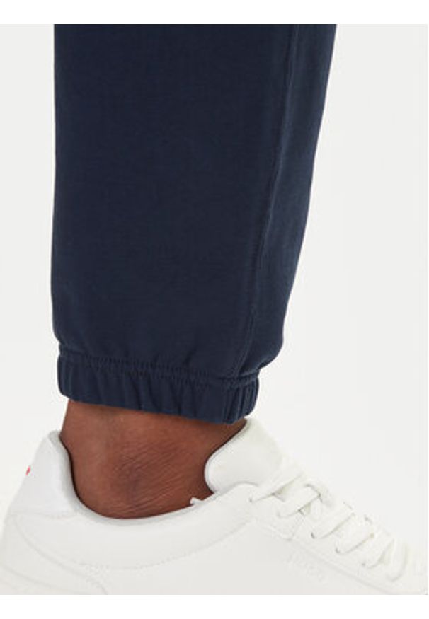 Calvin Klein Jeans Spodnie dresowe LV04RD241G Granatowy Regular Fit. Kolor: niebieski. Materiał: bawełna