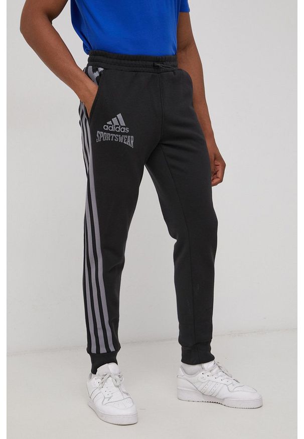 adidas Performance Spodnie męskie kolor czarny z nadrukiem. Kolor: czarny. Materiał: materiał. Wzór: nadruk