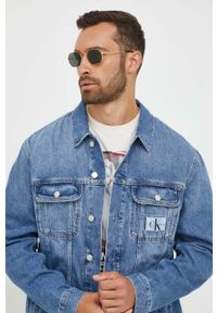 Calvin Klein Jeans kurtka jeansowa męska kolor niebieski przejściowa oversize. Kolor: niebieski. Materiał: bawełna, denim #1