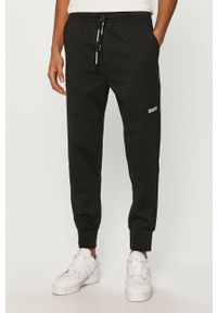 Calvin Klein Jeans - Spodnie. Kolor: czarny. Materiał: poliester, wiskoza, dzianina, elastan. Wzór: gładki #1