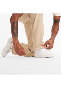 Spodnie męskie New Balance MP44587SNW – beżowe. Kolor: beżowy. Materiał: poliester, bawełna #3