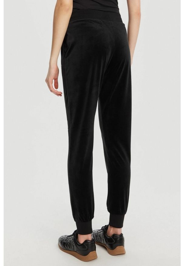 Guess - GUESS Czarne damskie spodnie dresowe Couture, Rozmiar S. Kolor: czarny. Materiał: dresówka