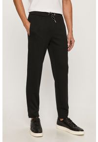 Armani Exchange - Spodnie. Kolor: czarny. Materiał: bawełna, poliester, dzianina, elastan. Wzór: gładki #1
