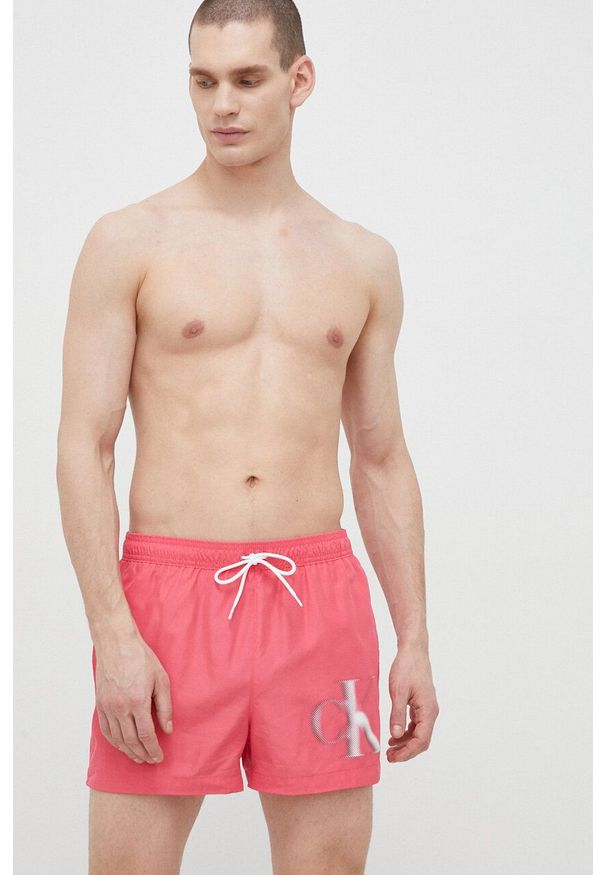 Calvin Klein szorty kąpielowe kolor różowy. Kolor: różowy. Materiał: tkanina, poliester, materiał. Wzór: nadruk