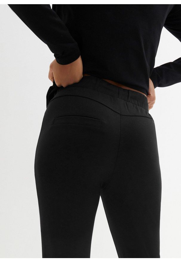 bonprix - Spodnie z gumką w talii, z wygodnego materiału punto di roma. Kolor: czarny. Materiał: materiał. Wzór: aplikacja