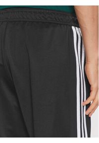 Adidas - adidas Spodnie dresowe Tiro IP3778 Czarny Regular Fit. Kolor: czarny. Materiał: bawełna #4