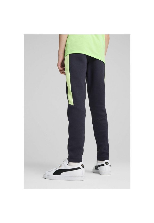 Puma - Młodzieżowe spodnie Evostripe PUMA New Navy Blue. Kolor: niebieski