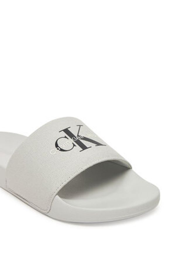 Calvin Klein Jeans Klapki Slide Monogram Cv YM0YM01271 Szary. Kolor: szary. Materiał: materiał