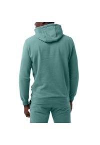 Puma - Bluza męska z kapturem PUMA PUMA ESS+ Tape Hoodie. Typ kołnierza: kaptur. Kolor: zielony