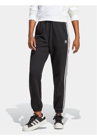Adidas - adidas Spodnie dresowe adicolor Classics IB7457 Czarny Regular Fit. Kolor: czarny. Materiał: bawełna #1