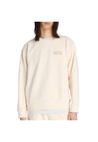 Bluza męska New Balance MT41547PEF - beżowa. Kolor: beżowy. Materiał: prążkowany, bawełna. Wzór: aplikacja. Styl: klasyczny