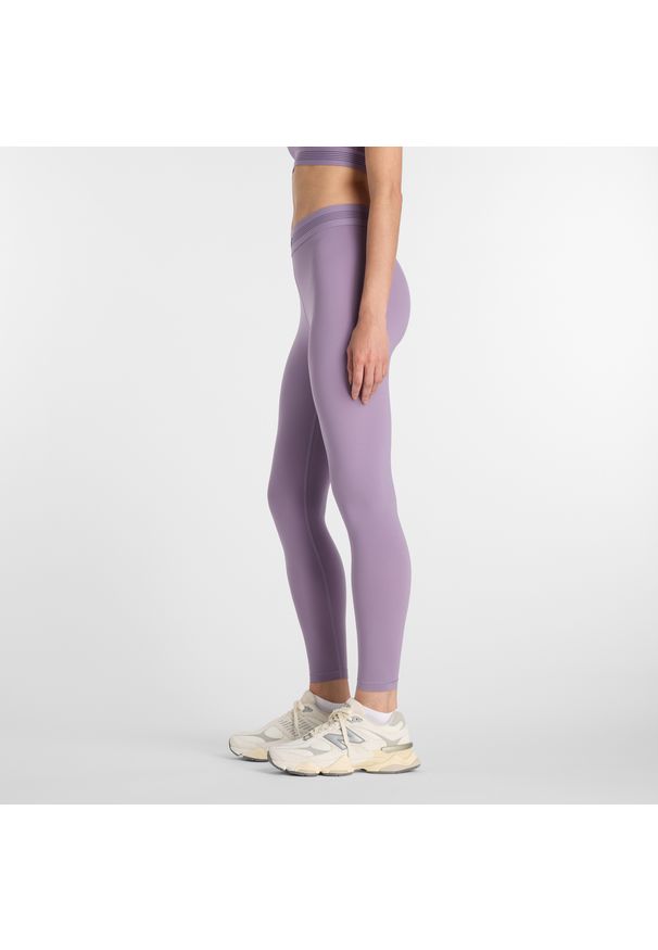 Legginsy damskie do treningu New Balance AC WB6160E1AA5 – fioletowe. Stan: podwyższony. Kolor: fioletowy. Materiał: poliester, lycra, materiał. Wzór: gładki. Sport: fitness