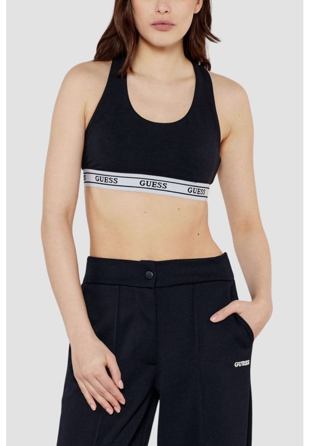 Guess - GUESS Czarny damski top sportowy Aline. Kolor: czarny. Styl: sportowy