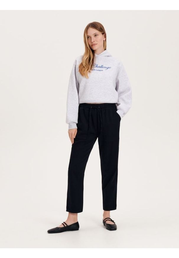 Reserved - Spodnie joggery - czarny. Kolor: czarny. Materiał: bawełna, tkanina