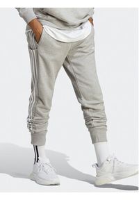 Adidas - adidas Spodnie dresowe Essentials French Terry Tapered Cuff 3-Stripes Joggers IC9407 Szary Regular Fit. Kolor: szary. Materiał: bawełna #6